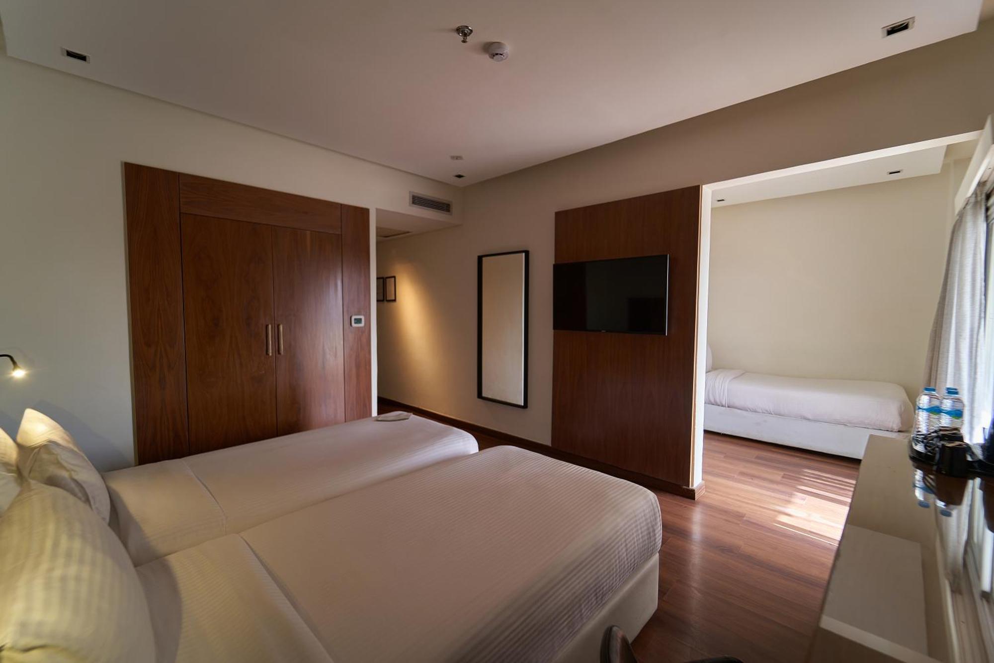 Deluxe Dreibettzimmer mit Balkon